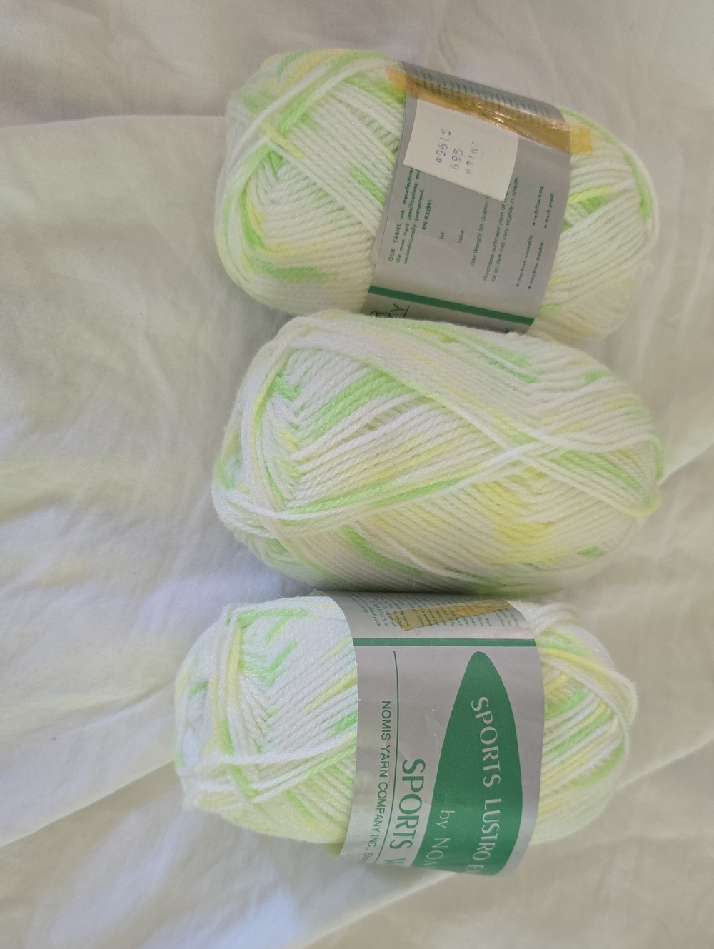 nomi White Yarn with Pale Green & Soft Yellow Accents